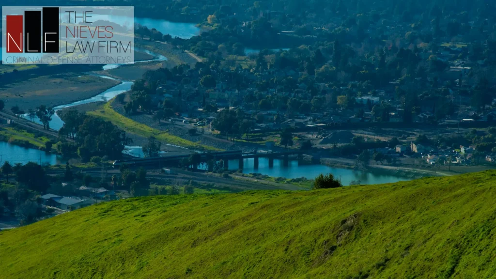 Alameda Creek winding through Fremont, seen from Vargas Plateau, with The Nieves Law Firm logo